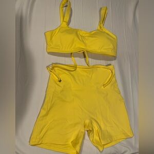 Yellow crossbody workout top and matching shorts